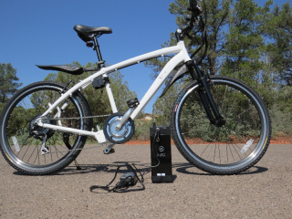The battery can be charged on or off the bike with the included charger