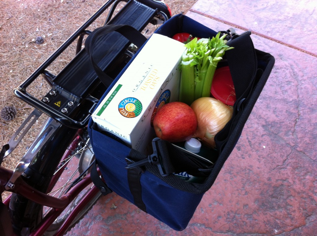 It would be nice to see the Jandd Grocery Pannier come stock with a cover to contain the contents when riding. You can buy an optional cover.