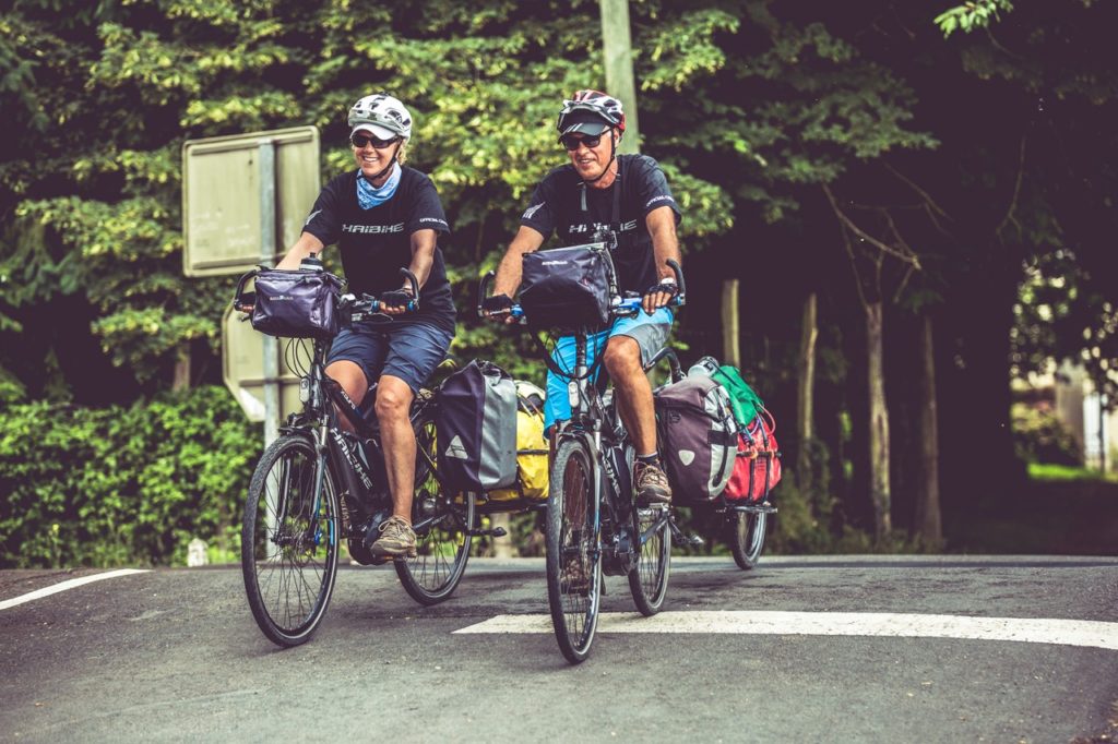 ebike cycle tourists riding with trailers