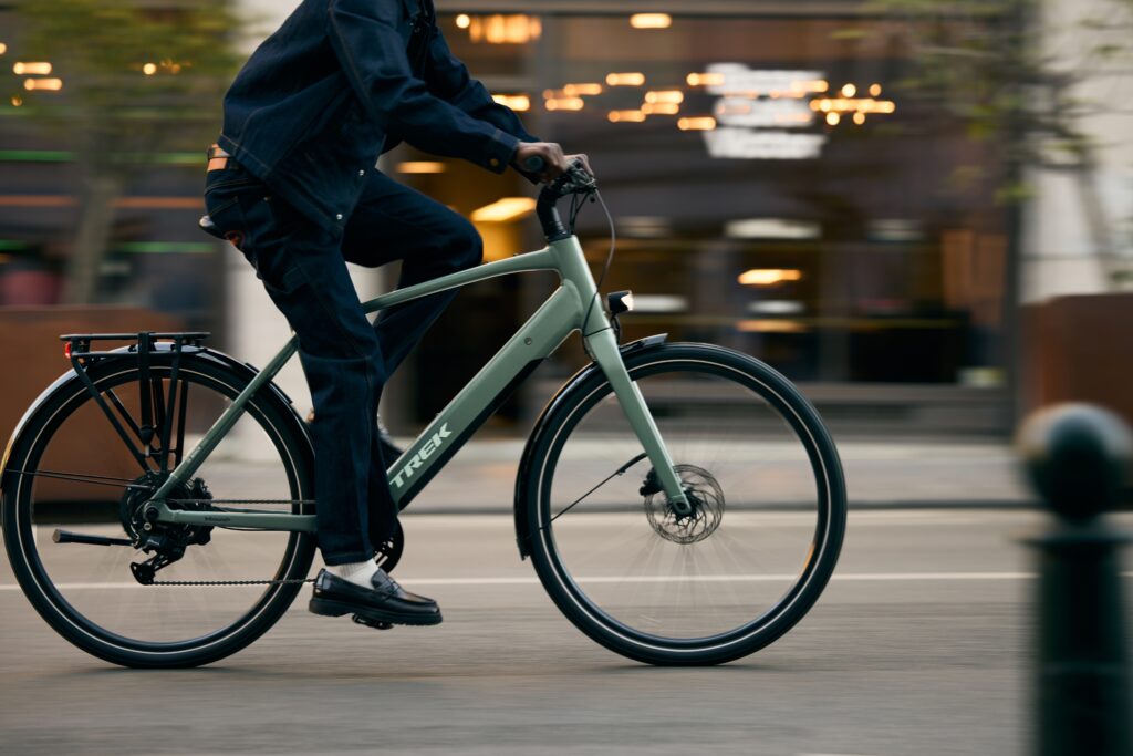 2026 Trek Inbound electric mountain bike being ridden on a trail