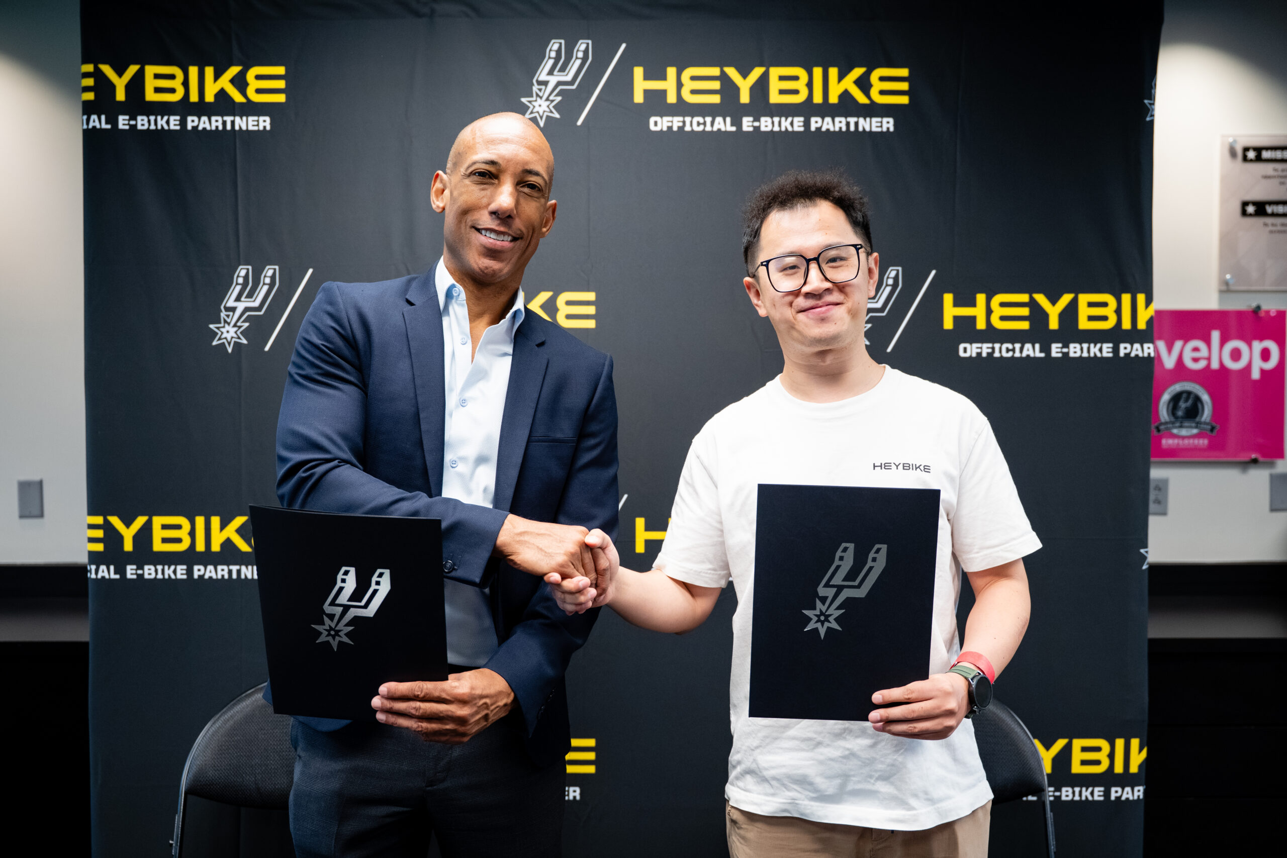 Heybike signing event with representatives at a brand partnership ceremony