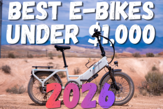 Electric white e-bike in a desert landscape with bold overlay text: 'Best E-Bikes Under $1,000 2026'