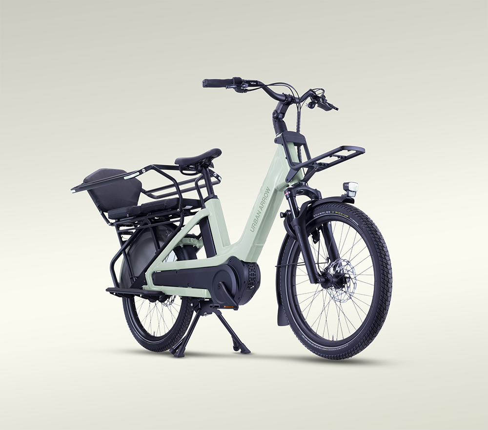 Breeze electric bike in green colorway shown from right front angle in studio setting