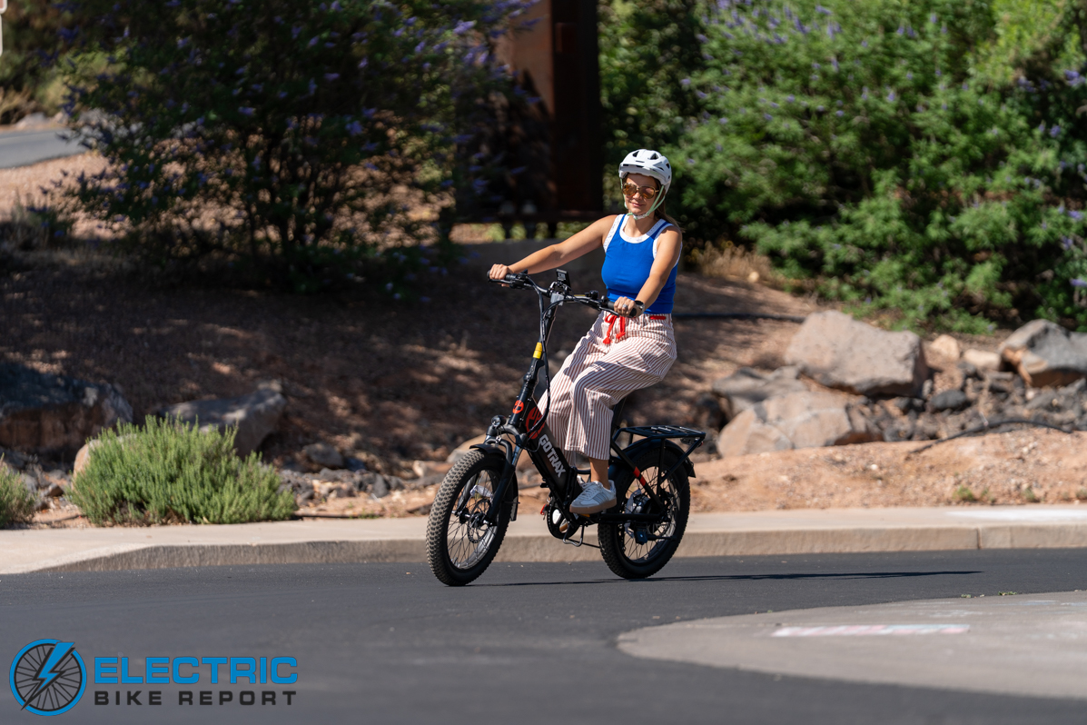 GoTrax F2 electric bike action shot rider in motion outdoor riding scene