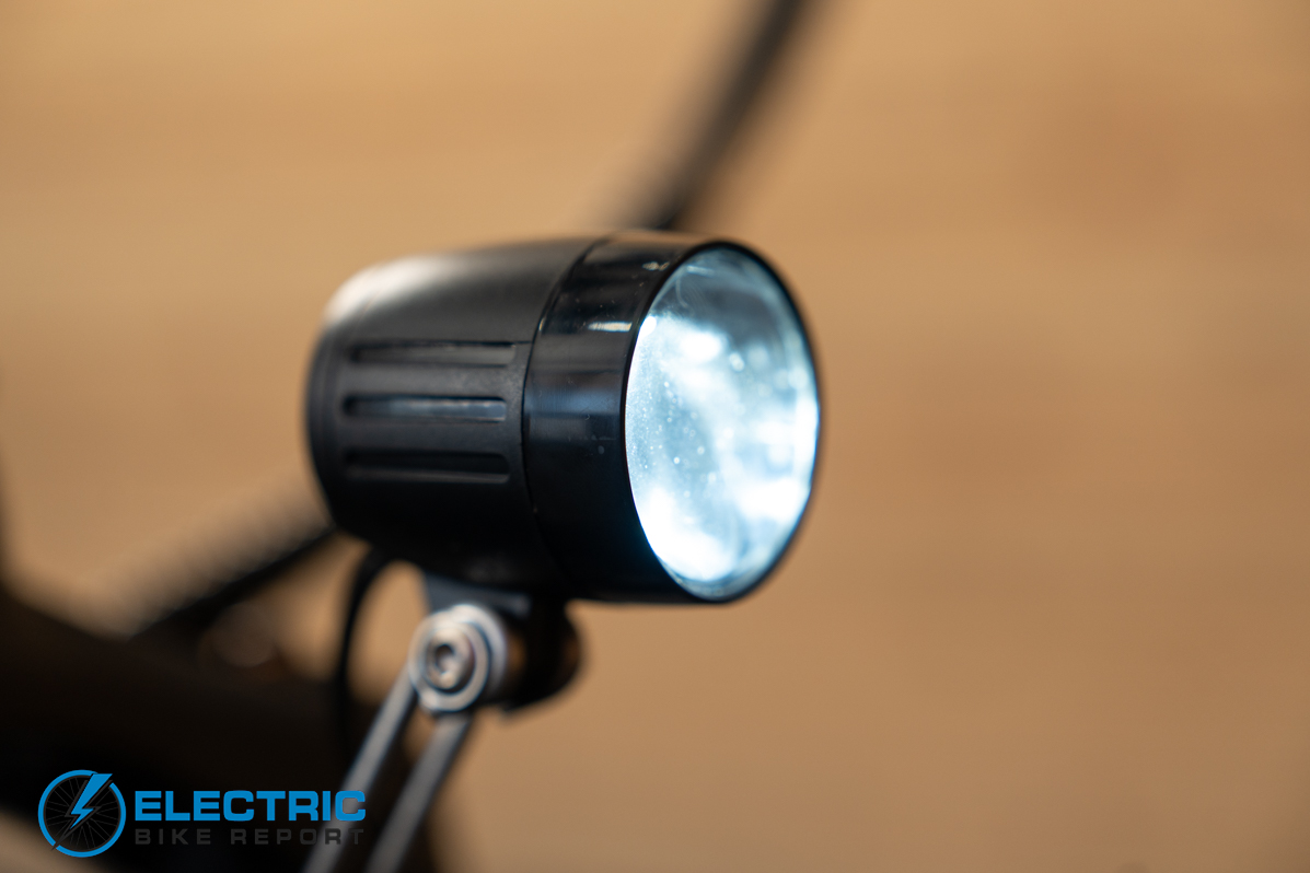 GoTrax F2 electric bike headlight illuminated during ride