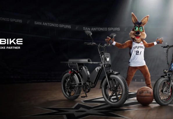 Promotional banner: two Heybike electric bikes on a basketball court with a Spurs mascot in a jersey under spotlights.