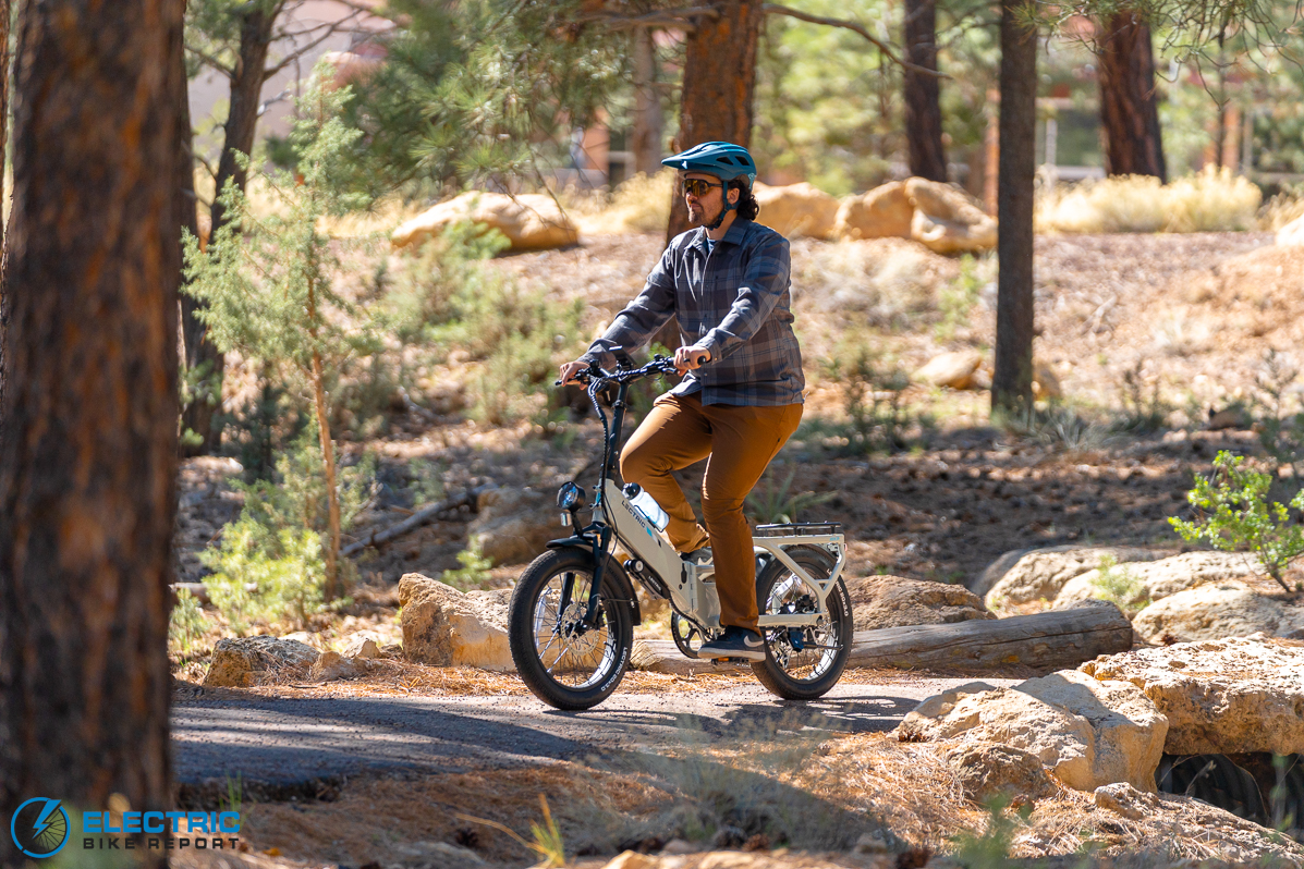 Lectric XP4 electric bike rider in action on an outdoor trail
