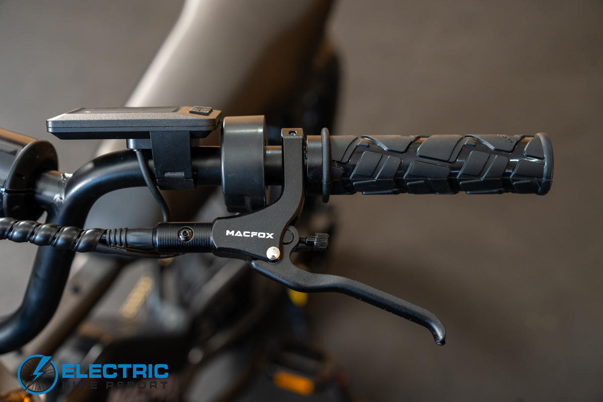 Macfox X7 left side handlebar controls and front-facing cockpit view