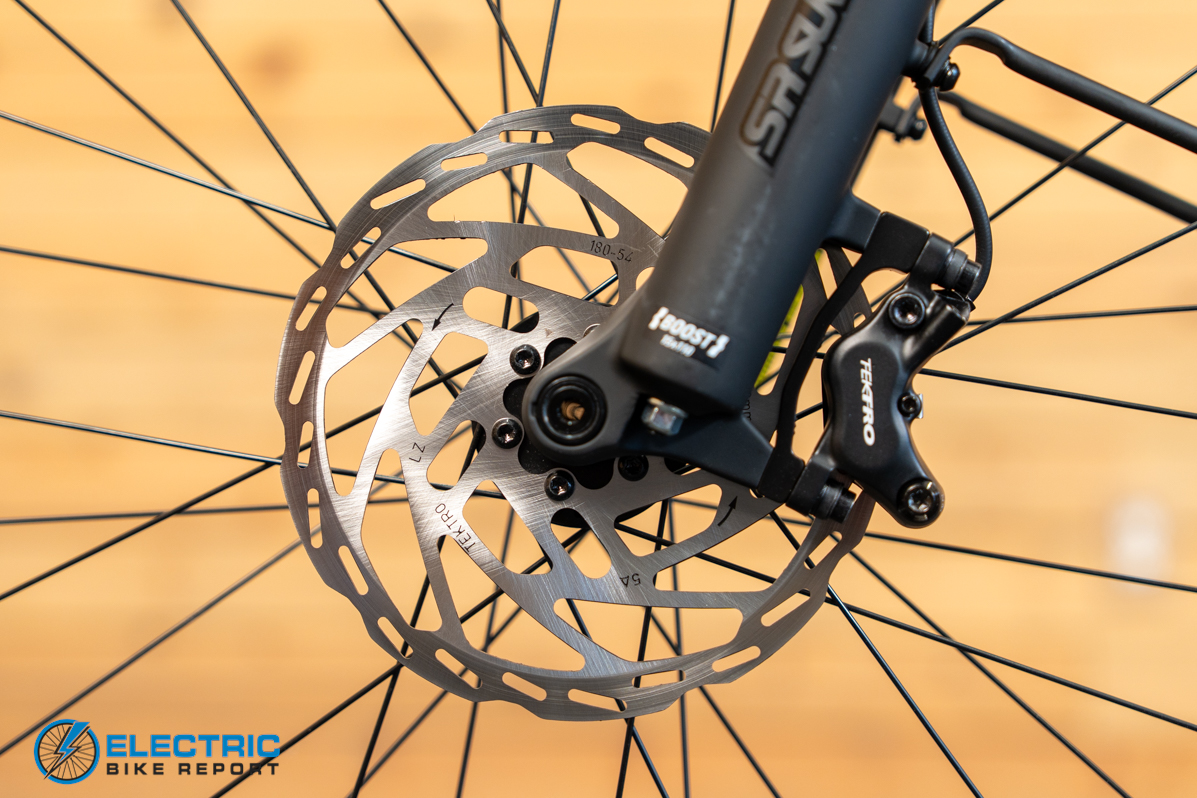 Momentum Vida E+ EX front brake caliper detail close-up