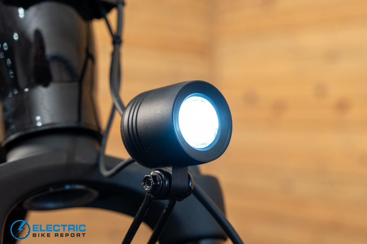 Momentum Vida E+ EX electric bike headlight illuminated front lighting detail