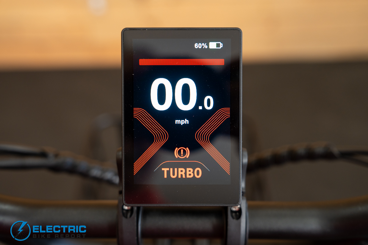Mooncool TK2 electric bike display screen in turbo mode with red backlight