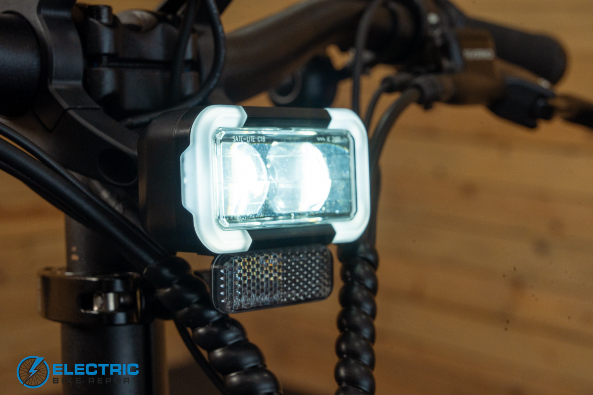 Pedego Latch 2 electric bike headlight illuminated front lighting detail