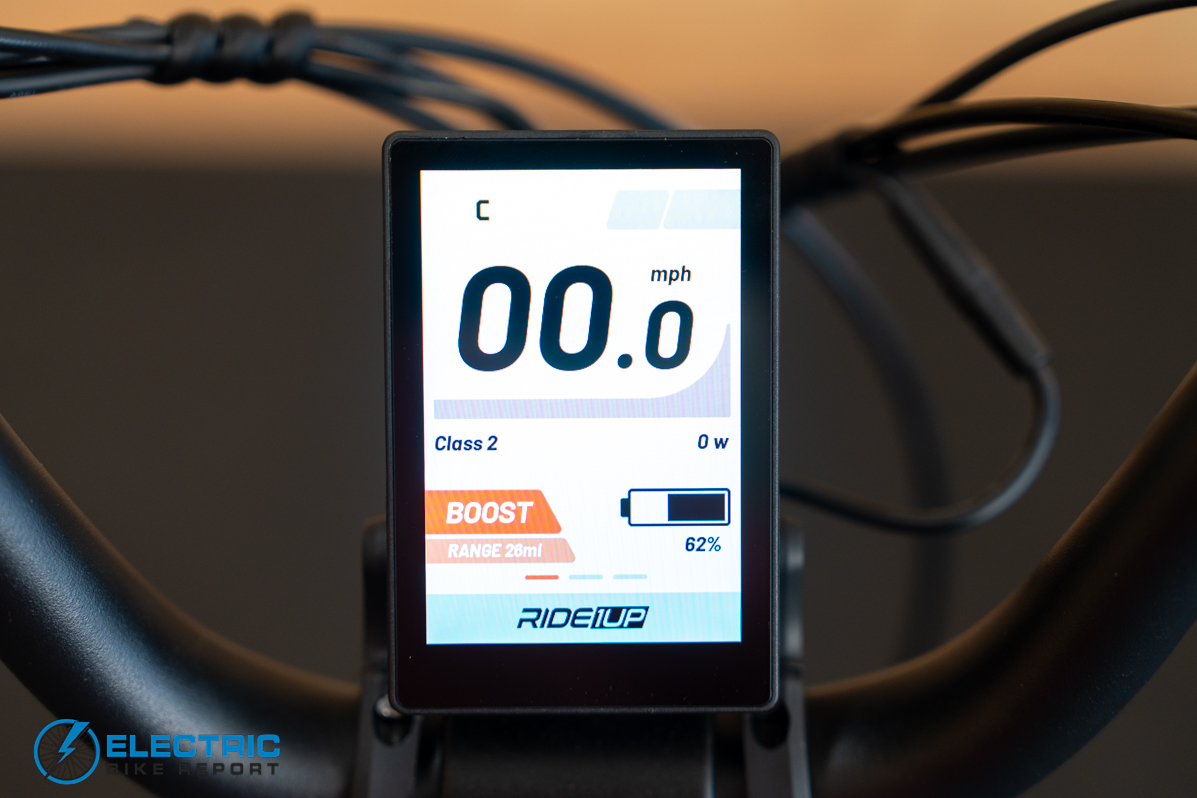 Ride1Up Portola display screen showing battery level assist mode and speed readout