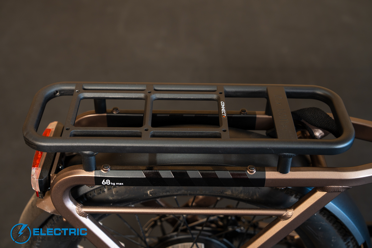 Ride1Up Portola rear rack detail showing cargo mounting options on the electric bike