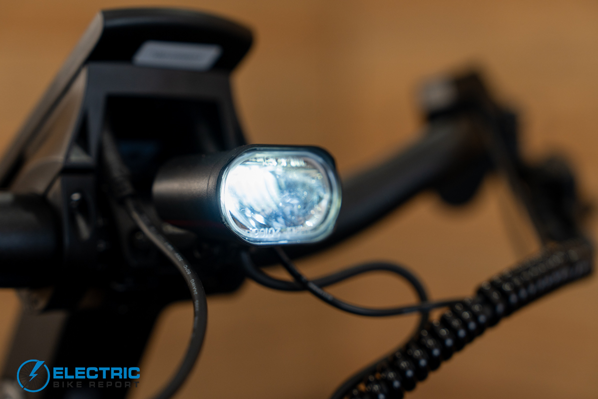 Troxus Trax Whim IQ electric bike headlight illuminated during night or low light riding